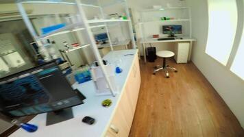 POV of team working to develop a new vaccine in modern equipped laboratory, man typing at computer. Group of biochemistry scientists examining virus evolution using high tech for researching treatment video