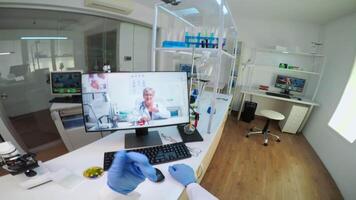 POV of scientist advicing with professional doctor on call, discussing during virtual meeting in medical laboratory. Chemist examining vaccine evolution using high tech researching treatment video