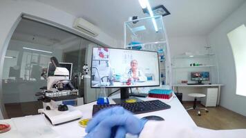 POV of scientist listening professional doctor on call, discussing during virtual meeting in medical research lab. Chemist examining vaccine evolution using high tech researching treatment video