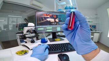 FPV of lab technician typing datas of patients from vacutainer, analysing blood samples. Team of researchers examining vaccine evolution using high tech chemistry tools for medical research video
