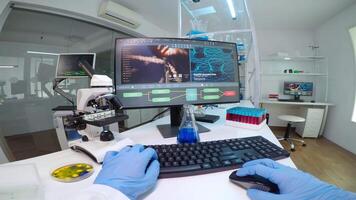 POV of scientist doctor doing research checking liquid from chemical container working in equipped laboratory. Team of researchers examining vaccine evolution using high tech chemistry tools video