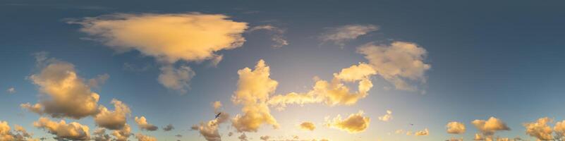 Dark blue sunset sky panorama with Cumulus clouds. Seamless hdr pano in spherical equirectangular format. Complete zenith for 3D visualization, game and sky replacement for aerial drone 360 panoramas. photo