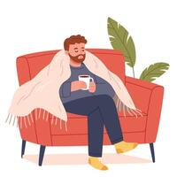 Young man sits on the sofa with a cup of tea wrapped in a blanket and is sick. vector