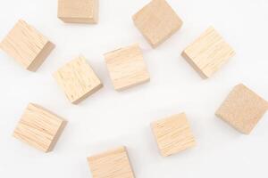 Wooden cube or wooden blocks on isolated background. Pile of wood block. Copy, empty space for text. photo