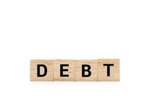 DEBT wooden text blocks isolated on white background. Copy space and clipping path. economic crisis risk and problem concept. Financial debt decrease, revenue management concept. photo