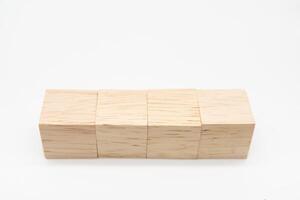 Four blank wooden blocks isolated on white background. Empty wooden cubes for text. Copy space. photo