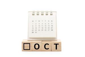 Calendar on Wooden blocks with OCT text isolated on white background. October and Calendar concept. Copy space. photo