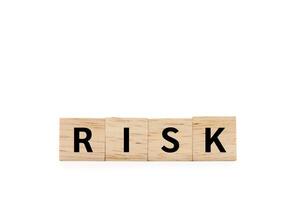 RISK wooden blocks of business concept isolated on white background. Copy space and Clipping Path. Financial Crisis, Economic, Business risk management. photo