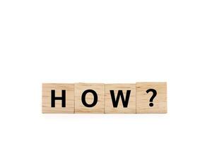 HOW text on wooden blocks of business concept isolated on white background. Copy space and clipping path. photo