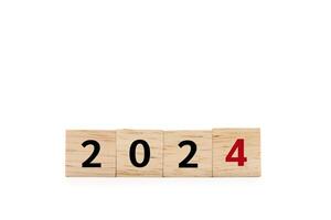 wooden cube blocks with 2024 text isolated on white background. numbers on wooden blocks with copy space and clipping path. 2024 new year idea concept. photo