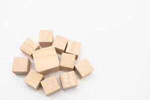 Wooden cube or wooden blocks on isolated background. Pile of wood block. Copy, empty space for text. photo