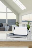 Home workspace, a laptop computer mockup on a table in a modern living room with a nature view. photo