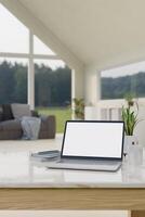 Home workspace, a laptop computer mockup on a table in a modern living room with a nature view. photo