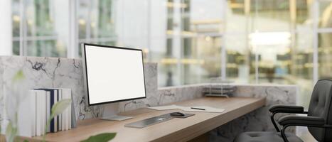 A computer mockup on a modern marble lobby reception counter. office reception, hotel lobby photo