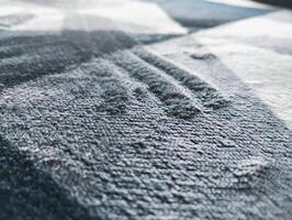 Abstract textured background A close up of a black and white abstract rug, carpet backround photo