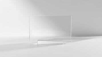 Minimalist transparent glass rectangle in a white space, showcasing simplicity and modern design for versatile use in various projects. photo