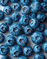 Close-up view of fresh and ripe blueberries. Perfect for illustrating healthy eating, natural food, and fruit-related themes. photo