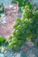 Fresh green grapes and pink drinks on ice offer a refreshing summer treat. Ideal for illustrating cooling beverages and fresh fruits. photo