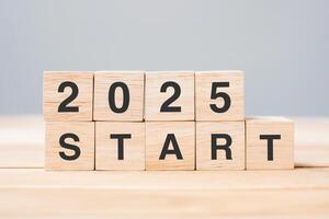 2025 START text on table. Resolution, strategy, goal, motivation, reboot, business and New Year holiday concepts photo