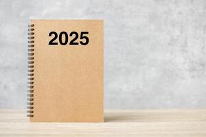 2025 Happy New Year calendar on table. countdown, Resolution, Goals, Plan, Action and Mission Concept photo