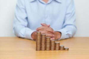 Money Saving for Future Plan, Retirement fund, Pension, Investment, Wealth Business and Financial concepts. coin stack on table, Money counting and stack arrangement for deposit photo