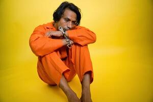 Man Looking down with handcuffs on wrists photo