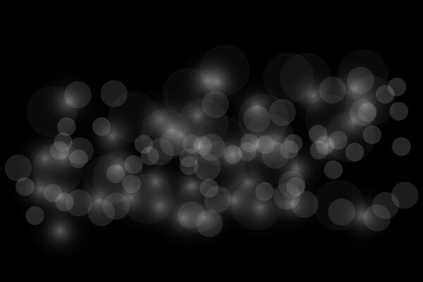 Blurred bokeh light on black background. Christmas and New Year holidays template.