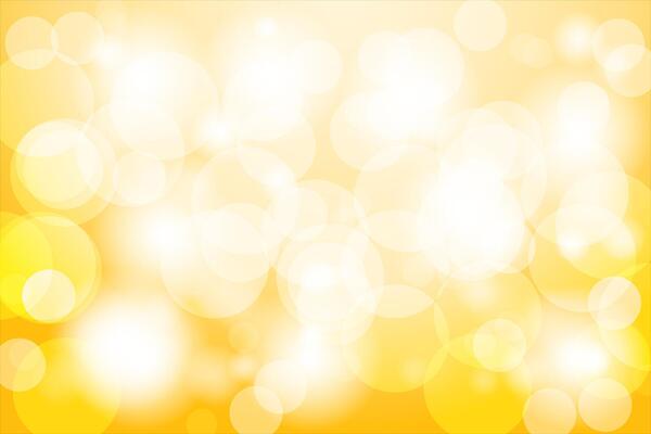 Blurred bright abstract bokeh on yellow background.