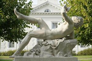 Trakai, Lithuania - September 13th 2023 - Dionysus drinking wine sculpture - Uzutrakis Manor, Tyszkiewicz family palace and park photo
