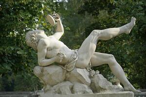 Trakai, Lithuania - September 13th 2023 - Dionysus drinking wine sculpture - Uzutrakis Manor, Tyszkiewicz family residence photo