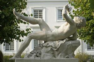 Trakai, Lithuania - September 13th 2023 - Dionysus drinking wine sculpture - Uzutrakis Manor, Tyszkiewicz family palace and park photo