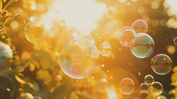 Bright soap bubbles floating against the background of sunlight photo