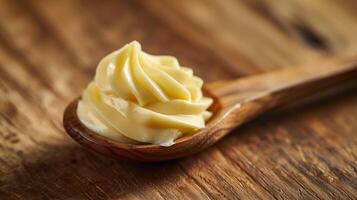 Creamy Butter Swirl on Wooden Spoon photo
