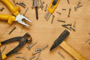 set of hand tools on a wooden surface photo