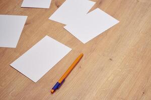 blank a 4 paper and a pen on a table photo