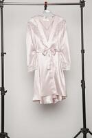 Satin women nighty on a white background. photo