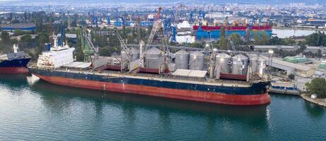 Aerial view from a drone of a large ship ready to loading grain for export. Water transport photo