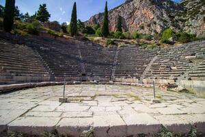 Ancient amphitheater of Delphi. Famous Archaeological site in Greece. God of Appollo temple. View of the ancient amphitheater. photo