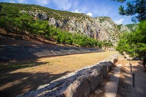 Ancient Stadium, Delphi, UNESCO World Heritage Site. Famous Archaeological site in Greece. God of Appollo temple. View of the ancient amphitheater. photo