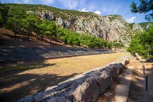 Ancient Stadium, Delphi, UNESCO World Heritage Site. Famous Archaeological site in Greece. God of Appollo temple. View of the ancient amphitheater. photo