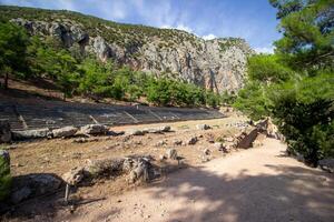 Ancient Stadium, Delphi, UNESCO World Heritage Site. Famous Archaeological site in Greece. God of Appollo temple. View of the ancient amphitheater. photo