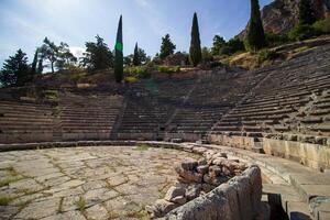 Ancient amphitheater of Delphi. Famous Archaeological site in Greece. God of Appollo temple. View of the ancient amphitheater. photo