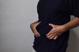 Man body fat belly. Obese Man with fat upset about her belly photo