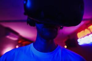 The player plays the game using virtual reality. Neon style. photo