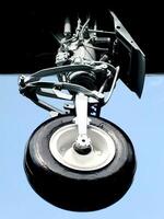 Close up of a landing gear of an airplane in the air. Airplane tire. Air transportation photo