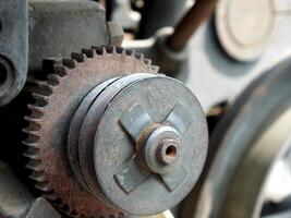 Close up of a part of the internal structure of an engine. Grunge steampunk industrial machine concept design image background photo