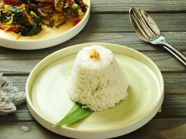 Assorted asian food set. Rice with side dishes on the wooden table. Top view. enjoy meal Time moment restaurant concept. Asian style banquet photo