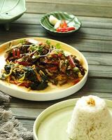 Assorted asian food set. Rice with side dishes on the wooden table. Top view. enjoy meal Time moment restaurant concept. Asian style banquet photo