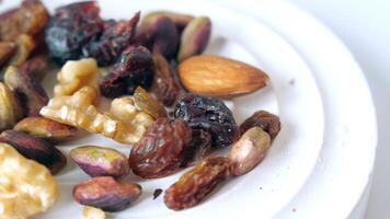 a bowl of mixed nut top down. video