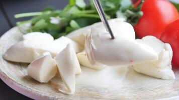 Fresh Mozzarella Cheese, soft and creamy Italian dairy used in cooking and as an appetizer video